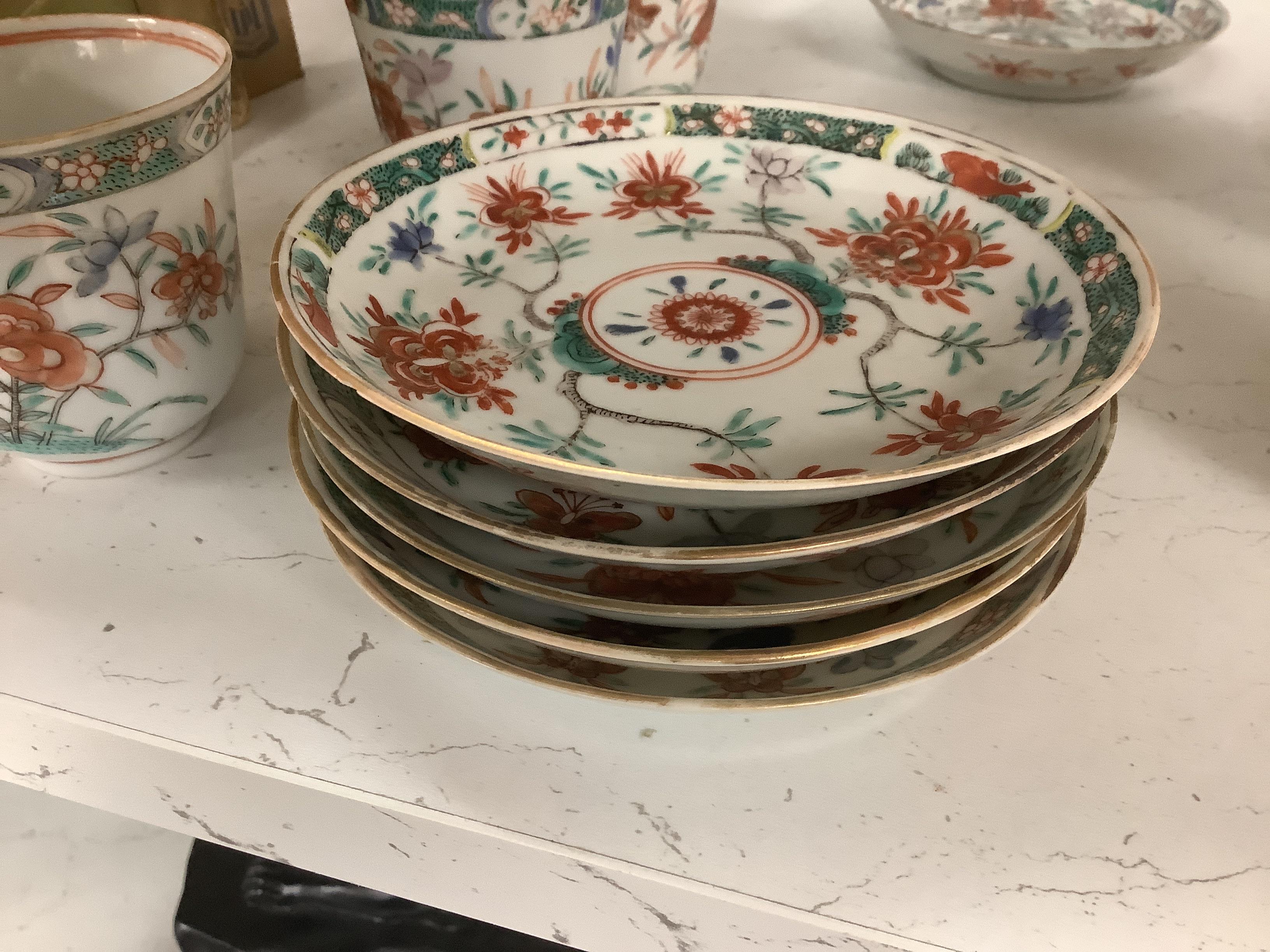 A set of six early 18th century Chinese cups and saucers with Dutch enamelled decoration, c.1710, 7.5cm high